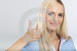 Woman showing thumb up sign