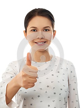 Woman showing thumb up sign isolated on white