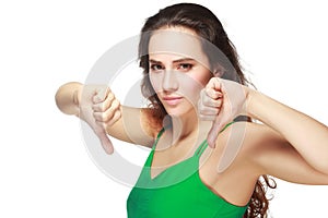 Woman showing thumbs down photo