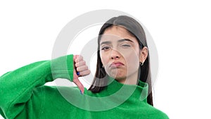 Woman Showing Thumbs Down In Disagreement On White Background