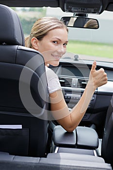 woman showing thumbs up