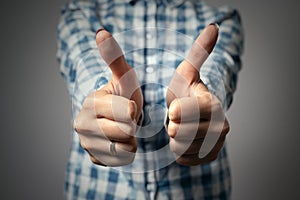 Woman showing thumbs up gesture