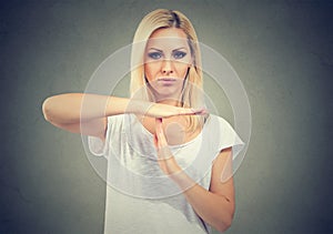 Woman showing time out hand gesture