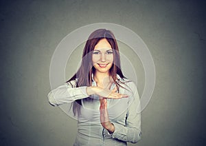 Woman showing time out hand gesture