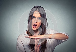 Woman showing time out hand gesture, frustrated screaming to stop