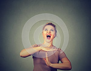 Woman showing time out hand gesture, frustrated screaming to stop