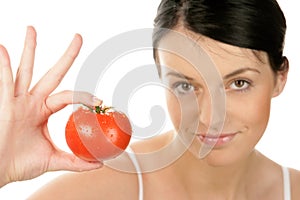 Woman showing tomato