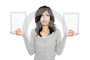 Woman showing two blank tablet computer screen