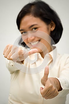 Woman showing two thumbs up