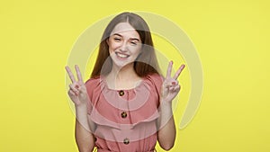 Woman showing victory or peace gesture, double v sign.