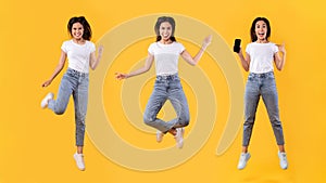 Woman showing white empty smartphone screen and jumping up