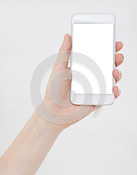 Woman shows blank display of mobile phone, hand points to device, blank screen cellular