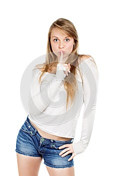 Woman shows gesture to be quiet