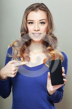 Woman shows a look at a smartphone