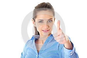 Woman shows thumb up, blue shirt, isolated