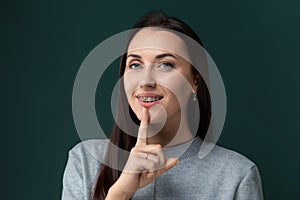 Woman Shushing With Finger on Lips