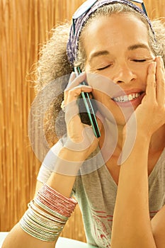 Woman shut eyes with smartphone