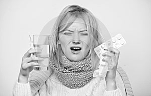 Woman sick person hold glass water and tablets blister. Take pills relieve fever. Drink plenty of fluids. Girl take