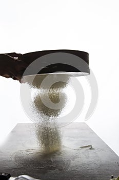 Woman Sieve flour with beautiful light