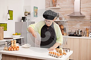 Woman is sifting flour