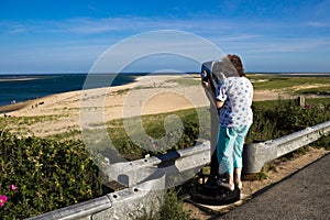 Woman Sight-seeing at a Cape Cod Beach