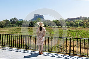 Woman with Sigiriya rock view in Sri Lanka