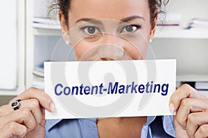 Woman with sign of content marketing in her hands
