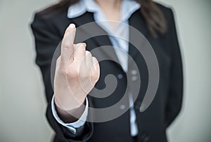 Woman signals come here with one finger