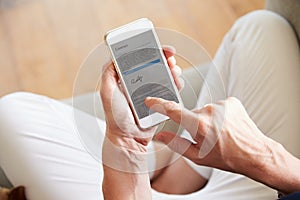 Woman Signing Contract On Smartphone At Home