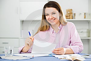 Woman is signing profitable financial agreement
