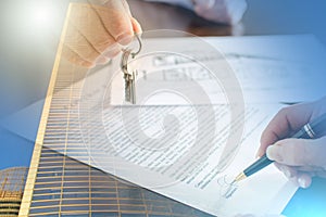 Woman signing a real estate contract; multiple exposure