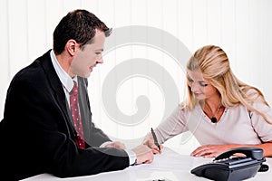 Woman signs a contract