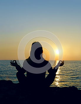 Woman silhouette making yoga