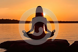 Woman Silhouette Practicing Yoga Pose and Meditation at Vibrant Sunset Ocean Beach extreme closeup. Generative AI