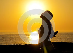 Woman silhouette in the sun