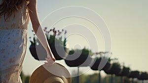 Woman silhouette walking in beautiful park. Long hair girl moving outdoors.