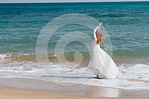 woman silhouette in a white dress by the ocean Fresh air