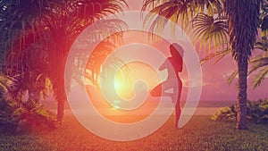 Woman silhouette in yoga pose on beach at sunrise