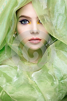 Woman in silk veil. colorful make-up girl. beauty portrait