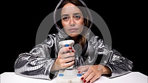 Woman with silver hoodie with arcade joystick