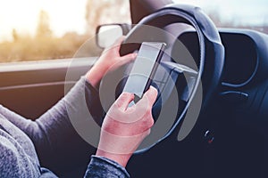 Woman simultaneously driving car and reading text message