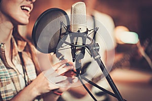 Woman singer in a studio