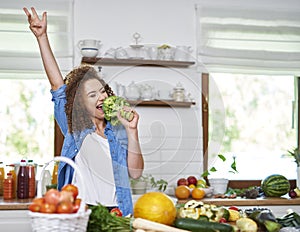 Woman singing while cooking a meal