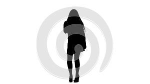 Woman sings incendiary songs into the microphone. White background. Silhouette. Slow motion