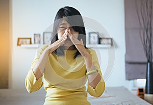 Woman with sinus and suffer from sinusitis,Female hand touching nose,Healthy and nasal