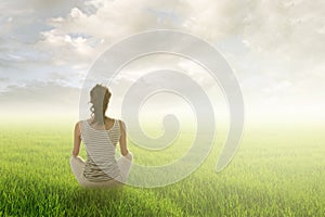 Woman sit on grassland