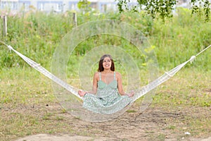 Woman sit on hammock in the park