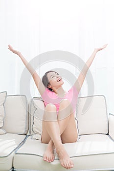 Woman sit on sofa