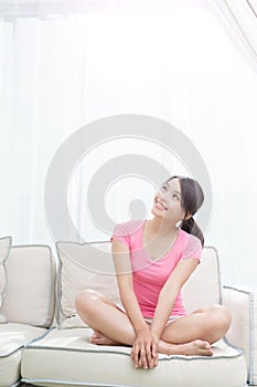 Woman sit on sofa