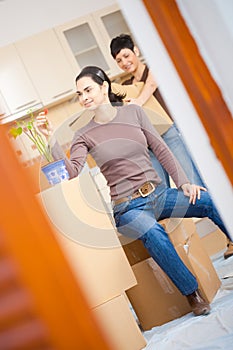 Woman sittin on cardboard box